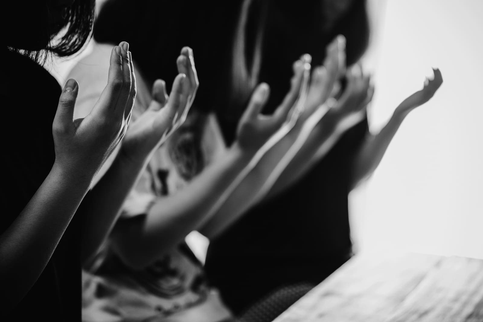 Hands raised in prayer